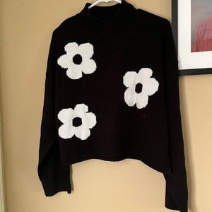 Black sweater with white flowers